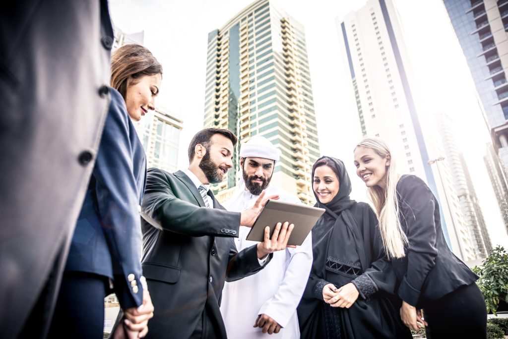 arabic,and,western,business,people,speaking,about,investments