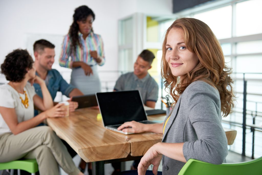 image,of,a,succesful,casual,business,woman,using,laptop,during